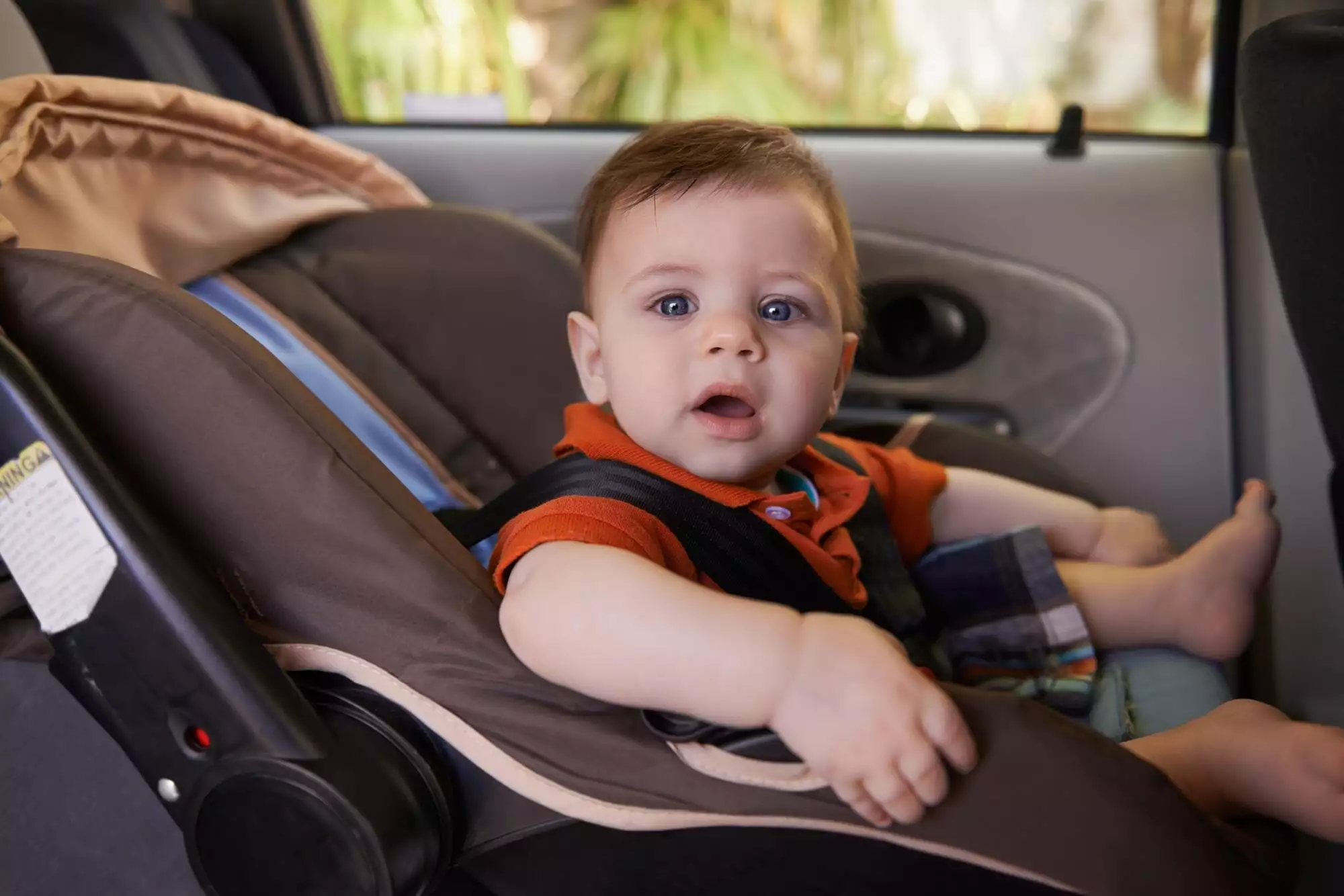 Every baby needs a carseat when traveling. Cropped shot a baby boy in a car seat.